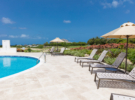 Royal_Westmoreland_Villas_on_the_green_5_Lounge_Chairs_by_pool_0