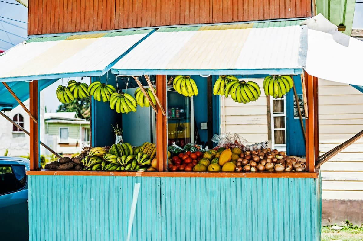 Blue fruit stand on Barbados street where you can buy affordable groceries