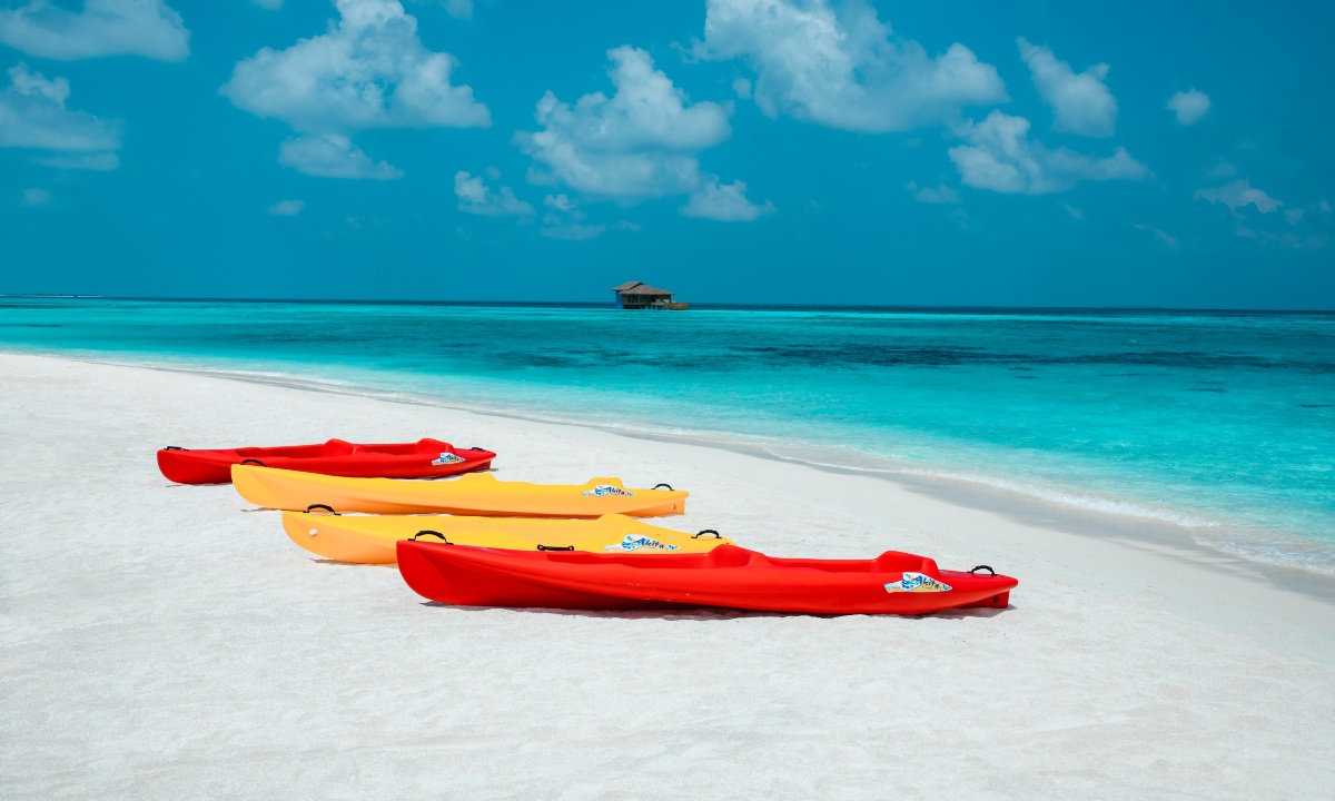 Kayaking in Barbados with vibrant blue waters and scenic tropical shoreline under sunny Caribbean skies.