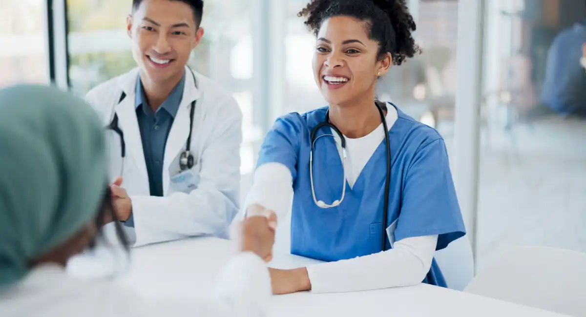Doctors consulting with a patient at a private clinic representing private healthcare services in Barbados used by expats and international residents