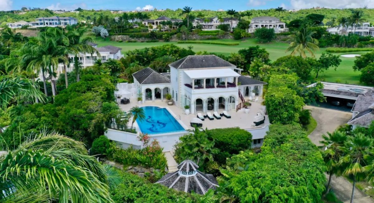 An aerial view of the lush landscape with Barbados properties along the ocean